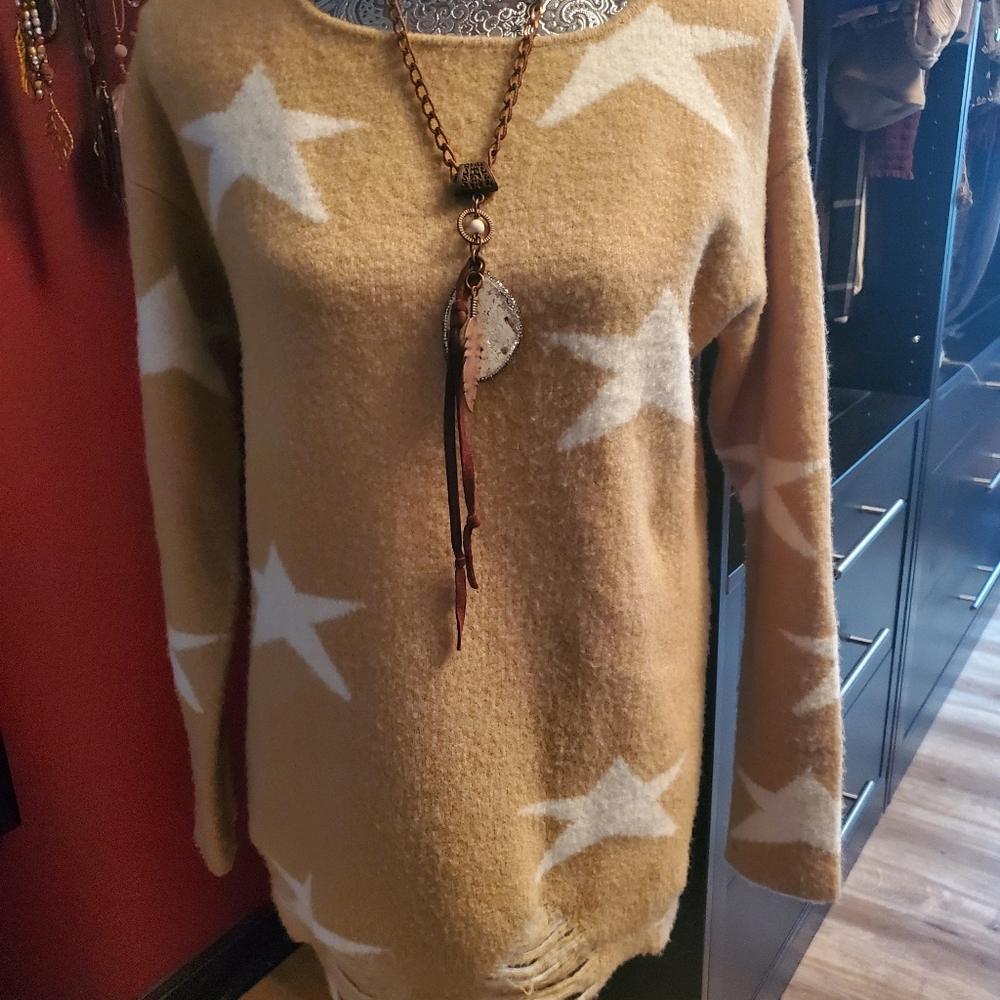 Stars Sweater Tan with White stars. Frayed look on bottom. Great look with Jeans